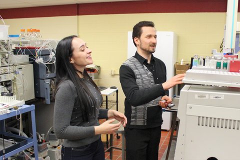 researchers looking at HPLC machine
